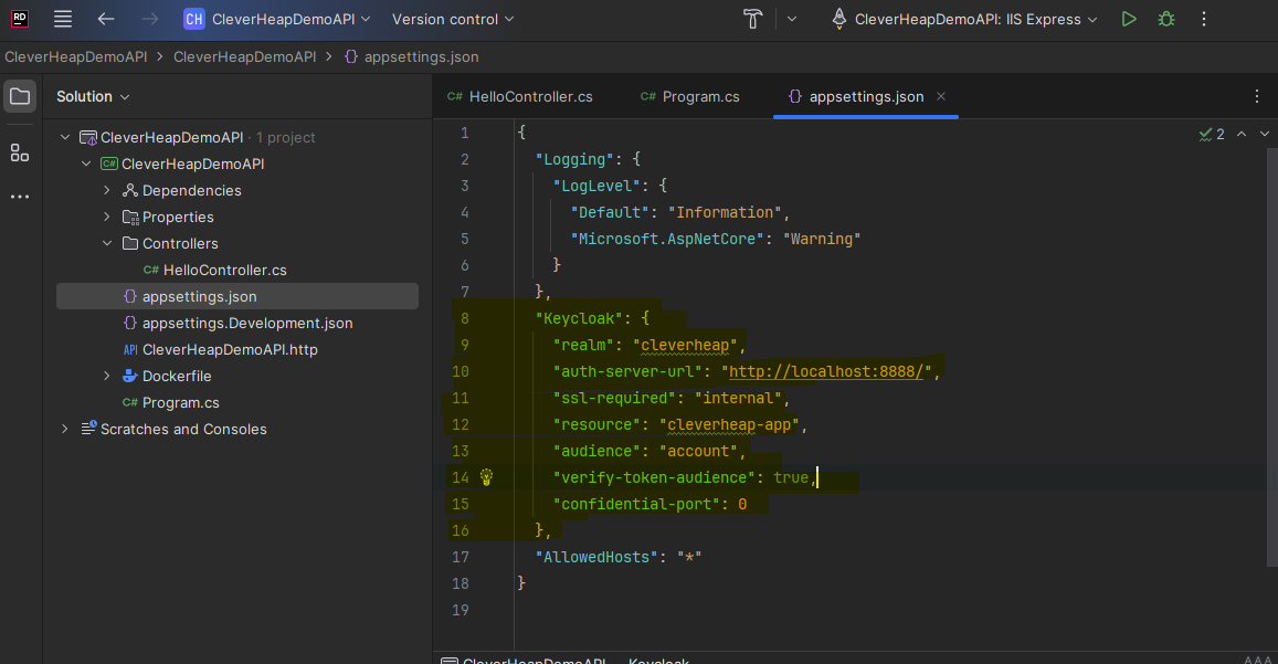 Displaying JetBrains Rider IDE project with opened solution project for WebAPI. Appsettings.json is displayed with added Keycloak section containing realm and client details, as well as Keycloak server url on port 8888.